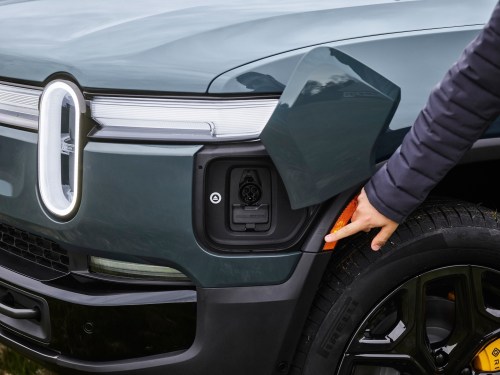 Rivian Faces Significant Revenue Decline Due to Persistent Supplier Issues Rivian next gen r1 charging port